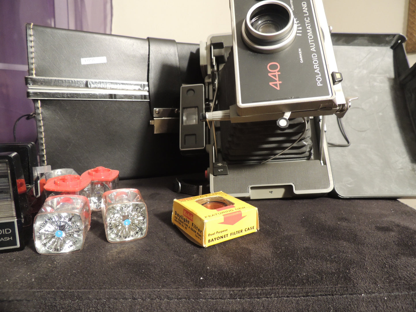 polaroid 440 with flash gun, flash cubes, filter case and original case