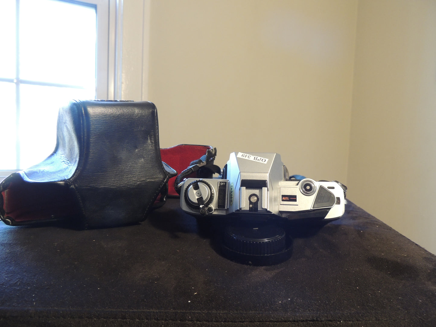 Minolta X-370 35mm Film SLR Camera, with original strap and leather case