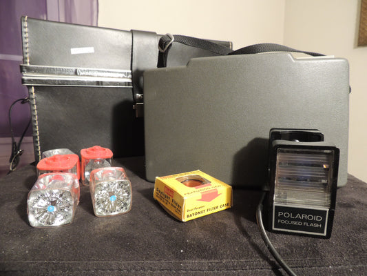 polaroid 440 with flash gun, flash cubes, filter case and original case