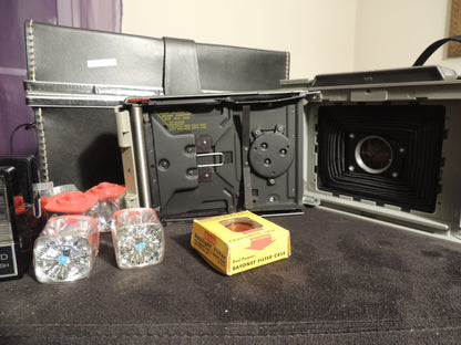 polaroid 440 with flash gun, flash cubes, filter case and original case