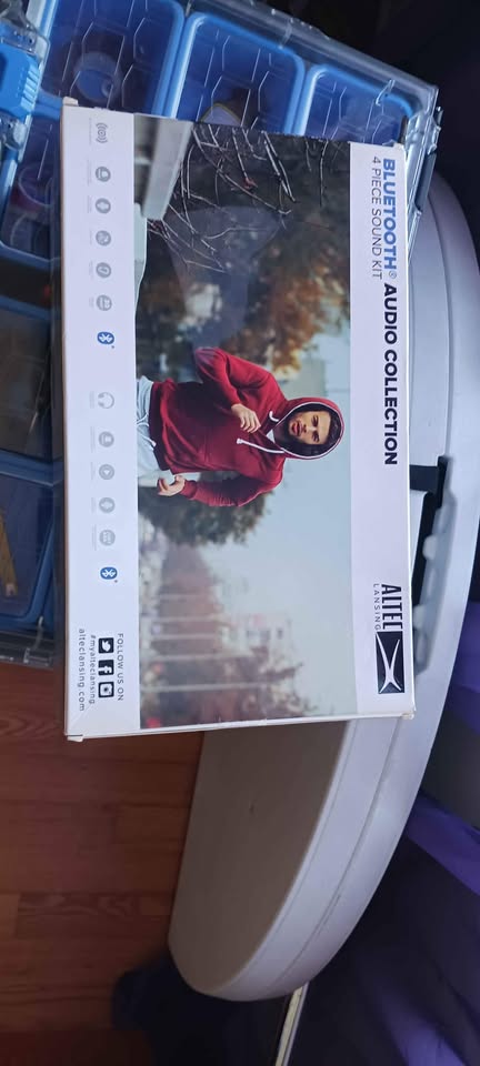 Four piece Bluetooth sound system. Headpiece, portable piece, wires and chargers. Unopened box.